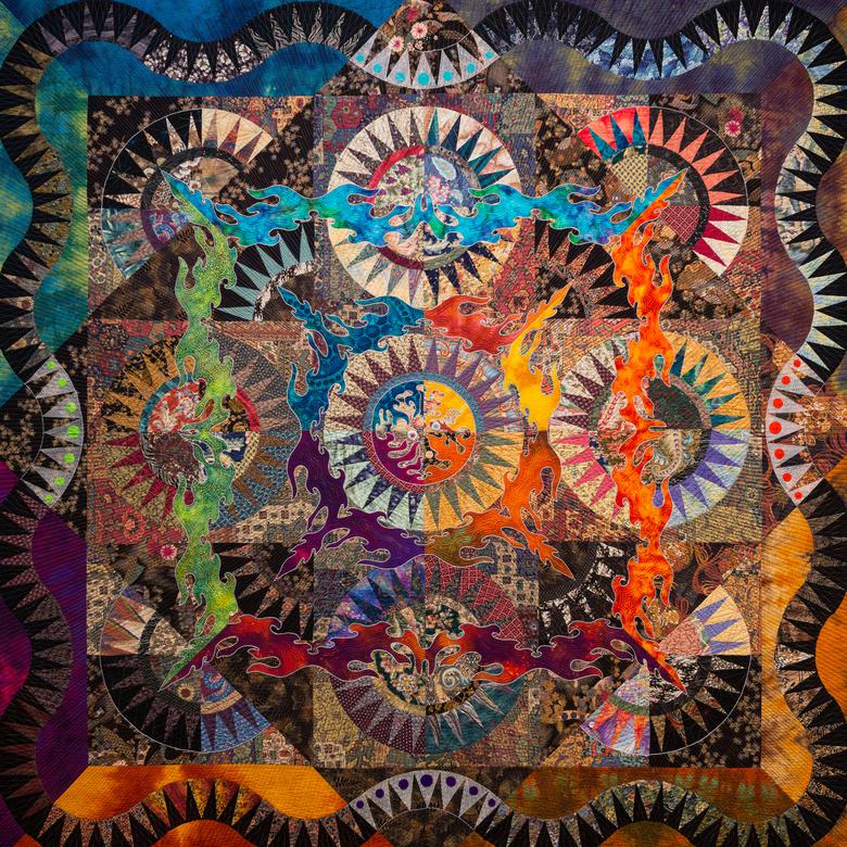 A textile by Kazuko Covington depicting worlds without end.